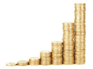 Stacks of gold coins arranged in an ascending order, symbolizing increasing financial equity and wealth accumulation related to homeownership and mortgage benefits.