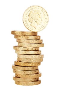 Stack of gold coins representing financial assets and liabilities related to loans and credit reports.