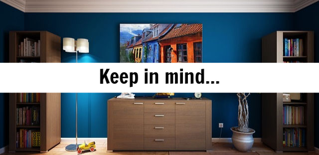 Interior room with blue walls, wooden furniture, bookshelves, and a lamp, featuring an overlay text "Keep in mind..." relevant to cash-out refinancing on land contracts.